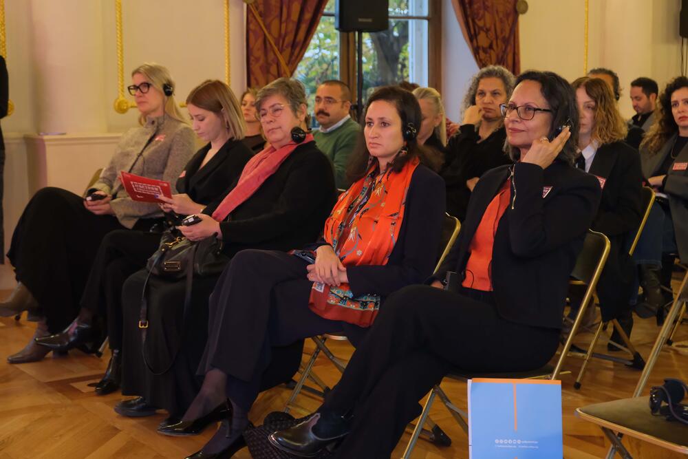 The keynote speakers Nadia Fanton, Mariam Khan and Hazal Kaya are seated and watching the event.