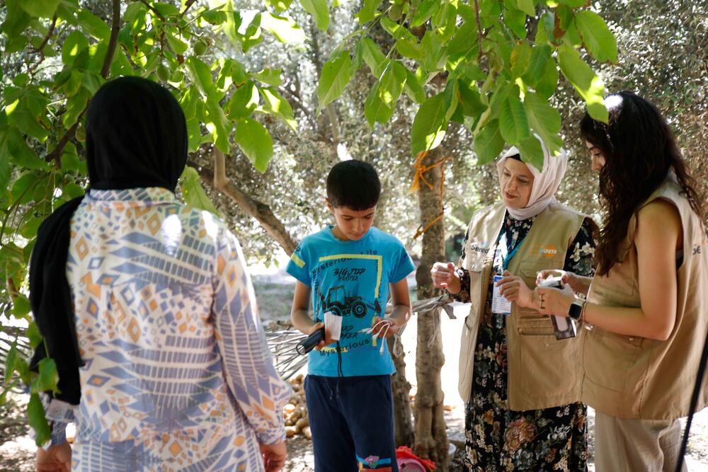 Hilal and her son Sinan, who has special needs, are with the personnel of SENED, our partner in the field. 