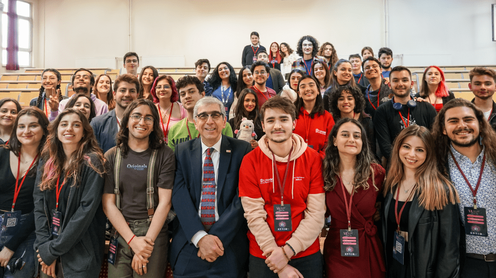 Hassan Mohtashami among young people in a classroom