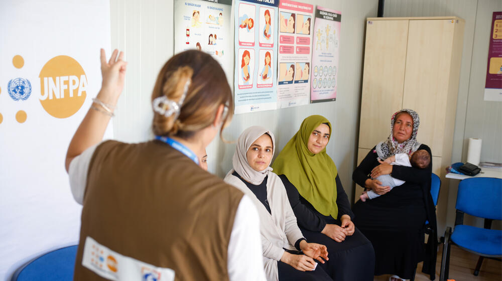 unfpa personnel is speaking with beneficiaries in a unfpa center